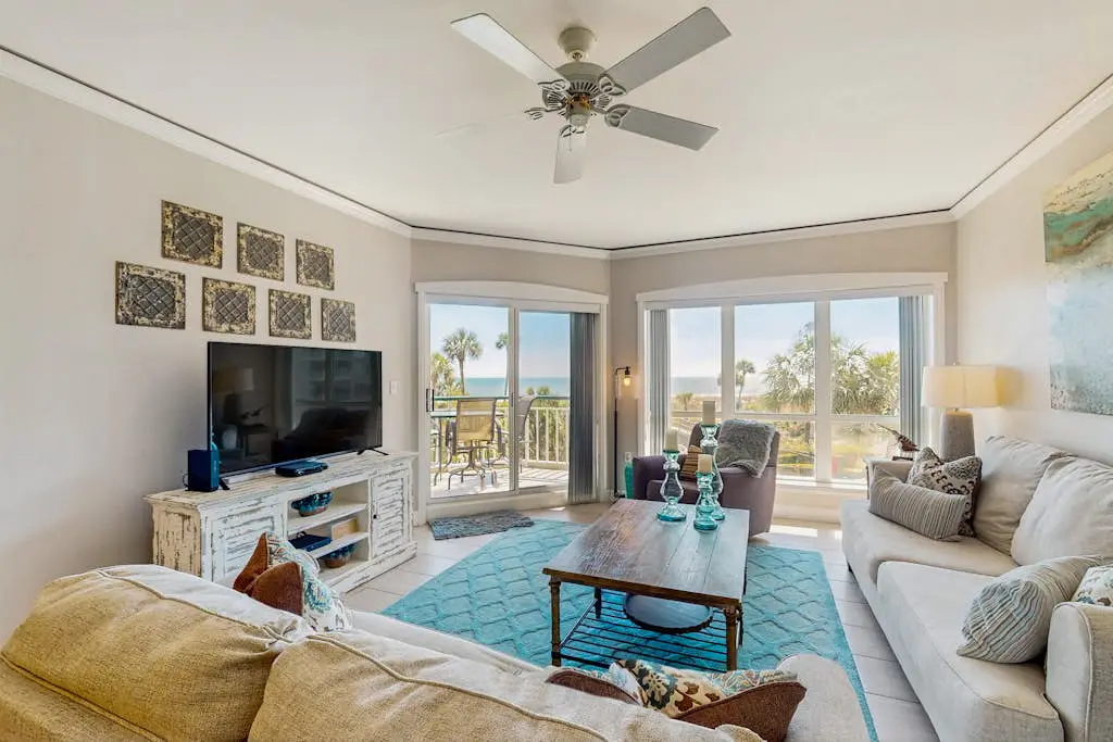 A spacious condo with community pool, hot tub, and oceanfront views