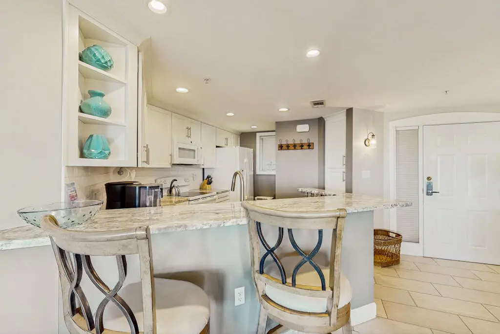 A spacious condo with community pool, hot tub, and oceanfront views