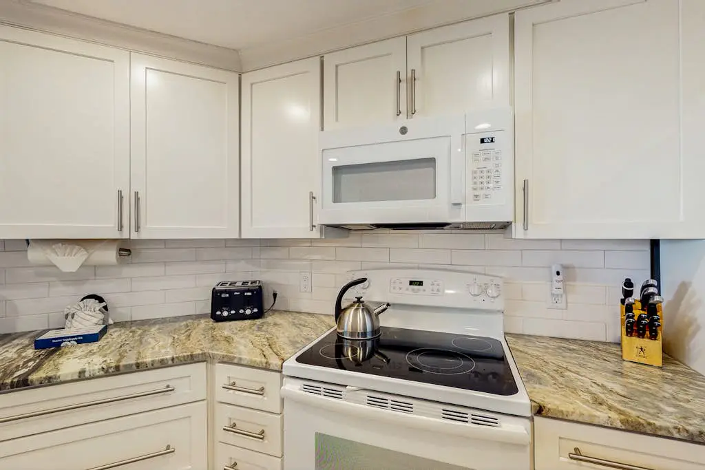 A spacious condo with community pool, hot tub, and oceanfront views