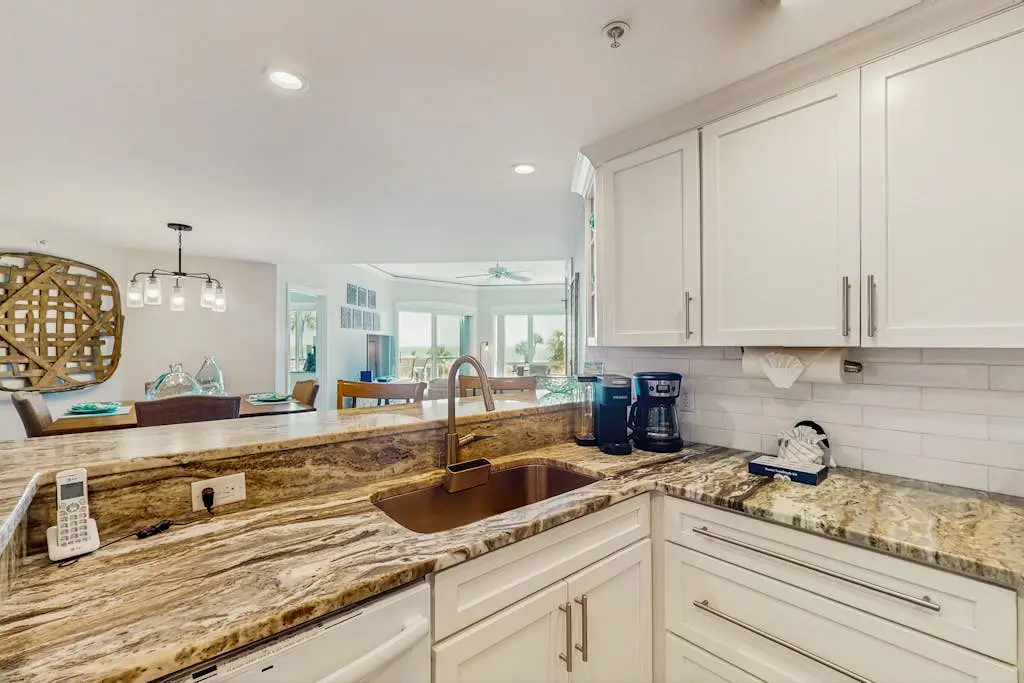 A spacious condo with community pool, hot tub, and oceanfront views