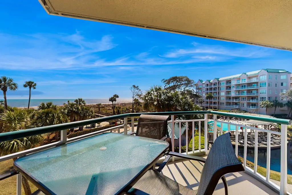 A spacious condo with community pool, hot tub, and oceanfront views