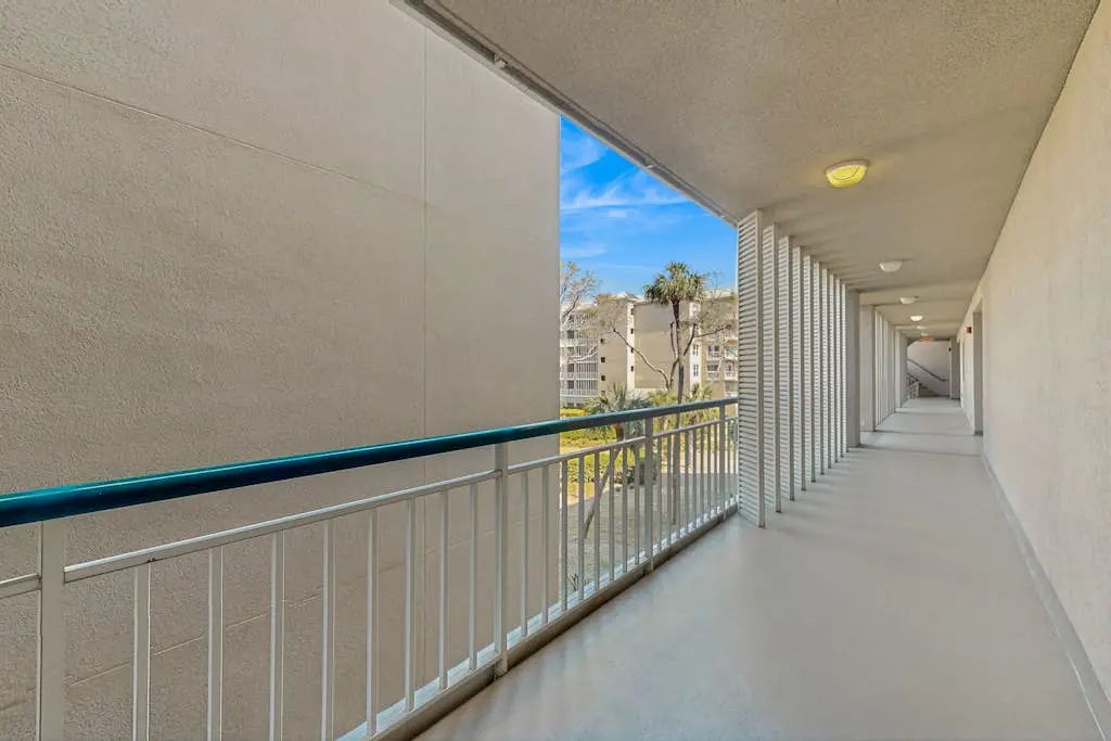 A spacious condo with community pool, hot tub, and oceanfront views