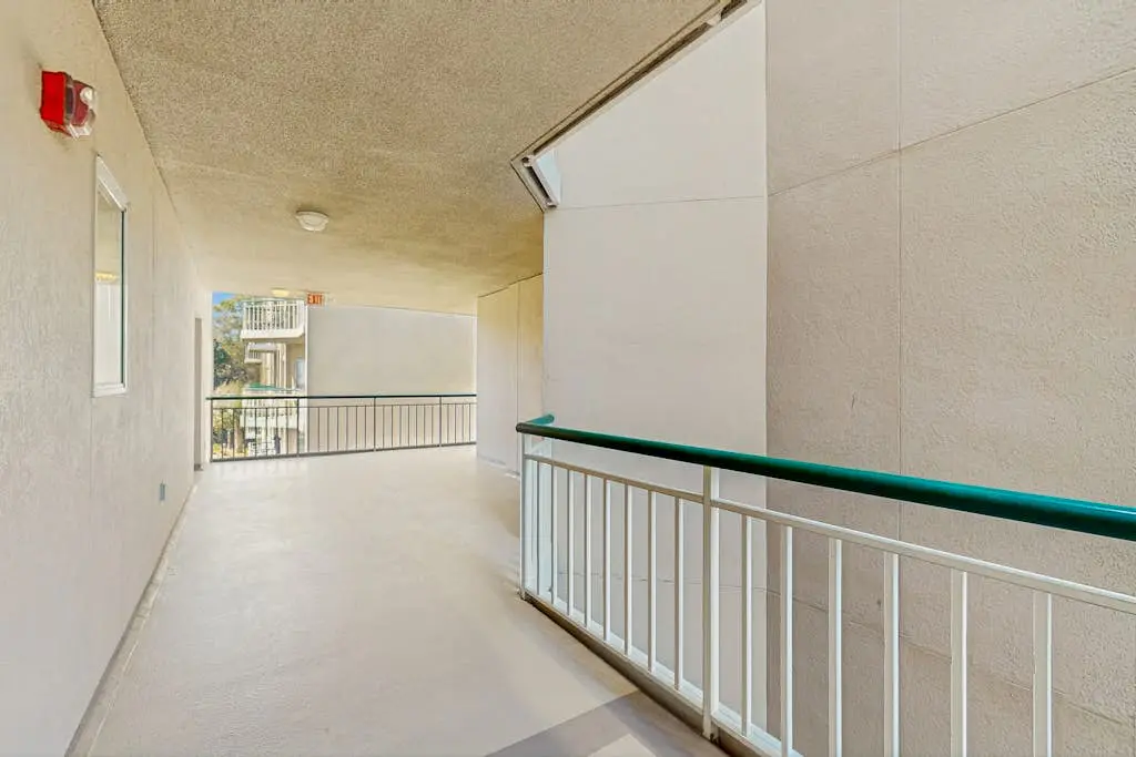 A spacious condo with community pool, hot tub, and oceanfront views
