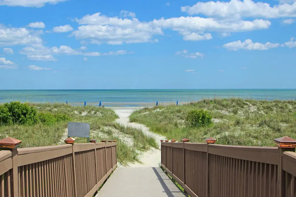 A spacious condo with community pool, hot tub, and oceanfront views
