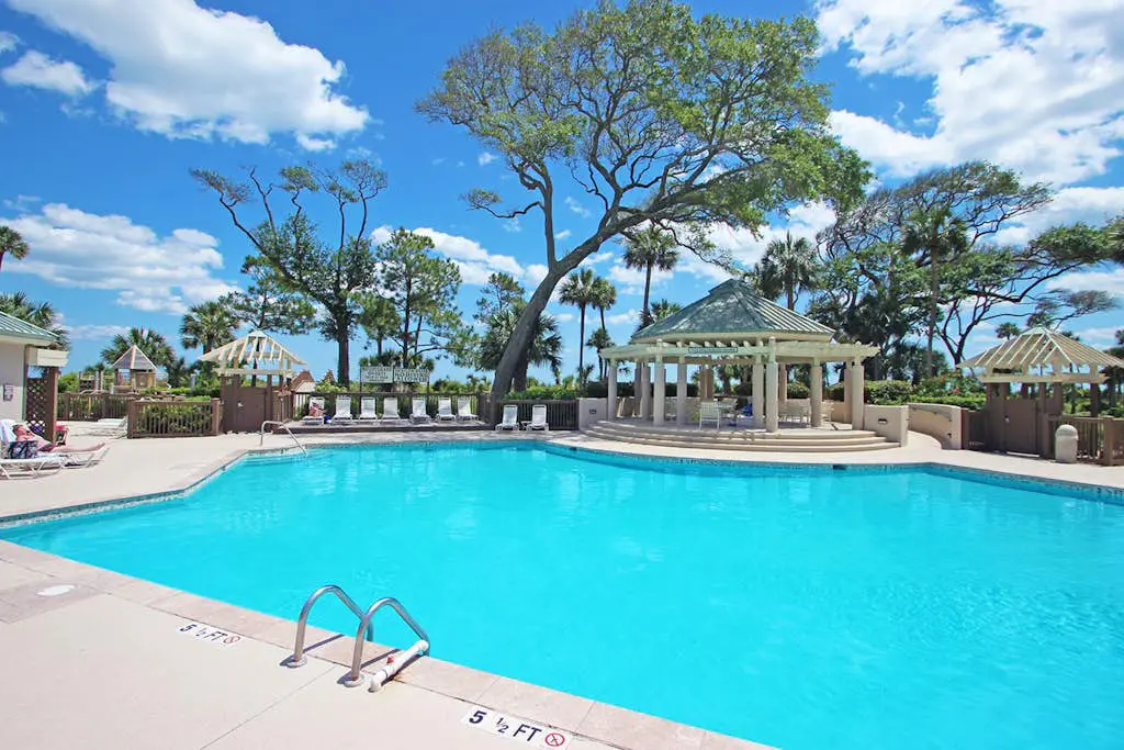 A spacious condo with community pool, hot tub, and oceanfront views