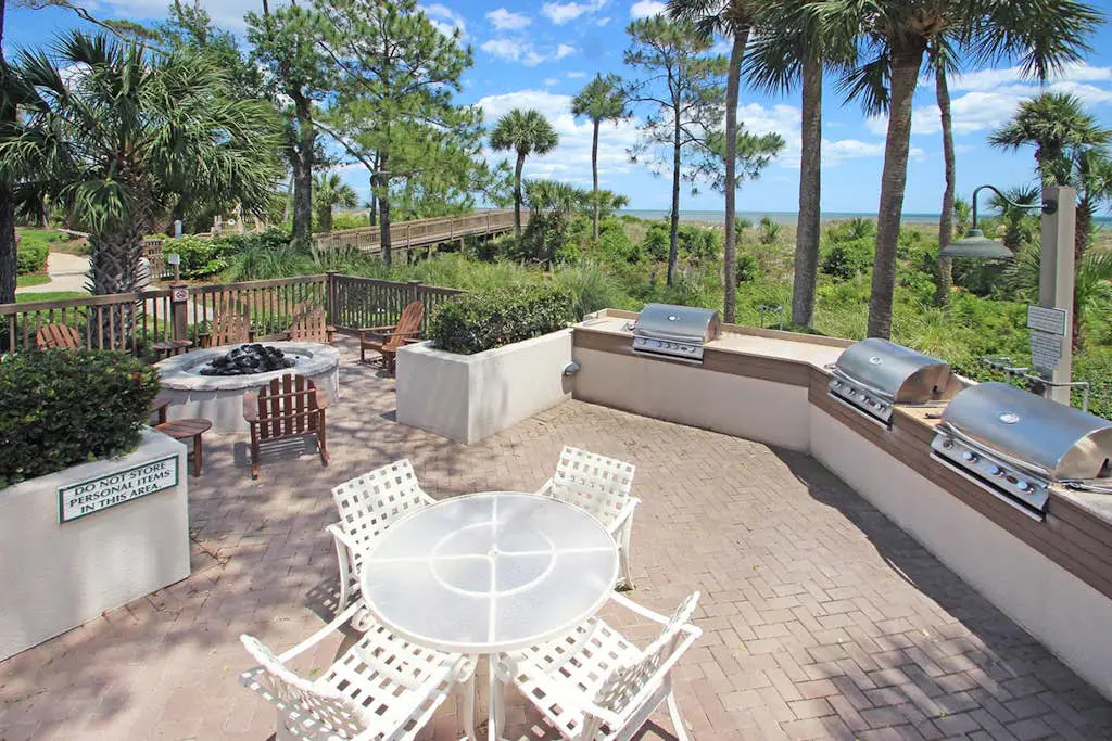 A spacious condo with community pool, hot tub, and oceanfront views