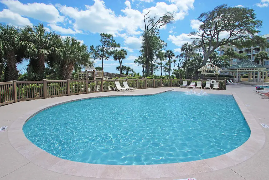 A spacious condo with community pool, hot tub, and oceanfront views