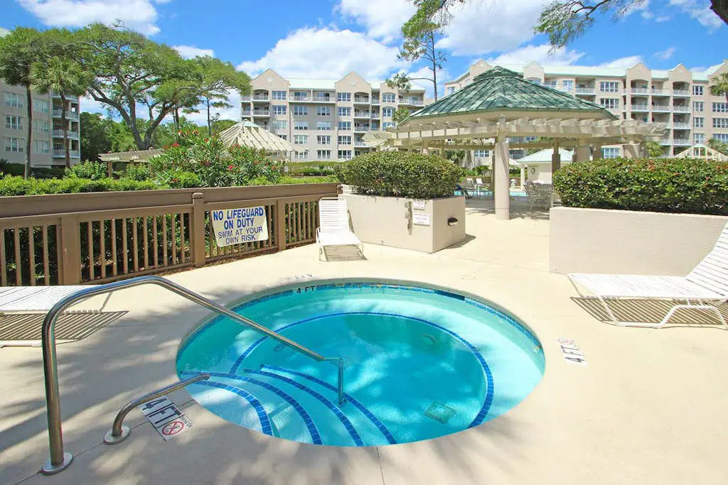 A spacious condo with community pool, hot tub, and oceanfront views