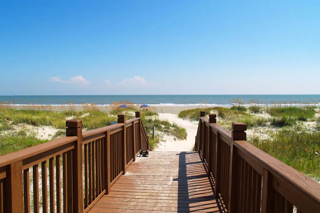 A spacious condo with community pool, hot tub, and oceanfront views