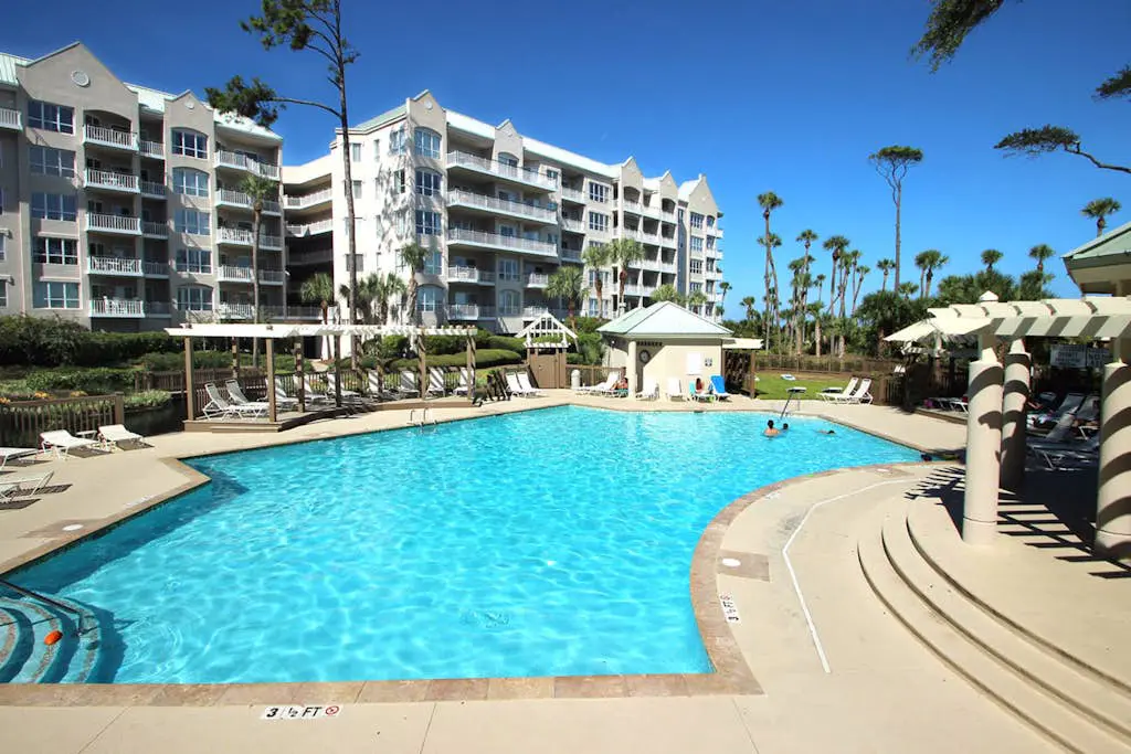 A spacious condo with community pool, hot tub, and oceanfront views