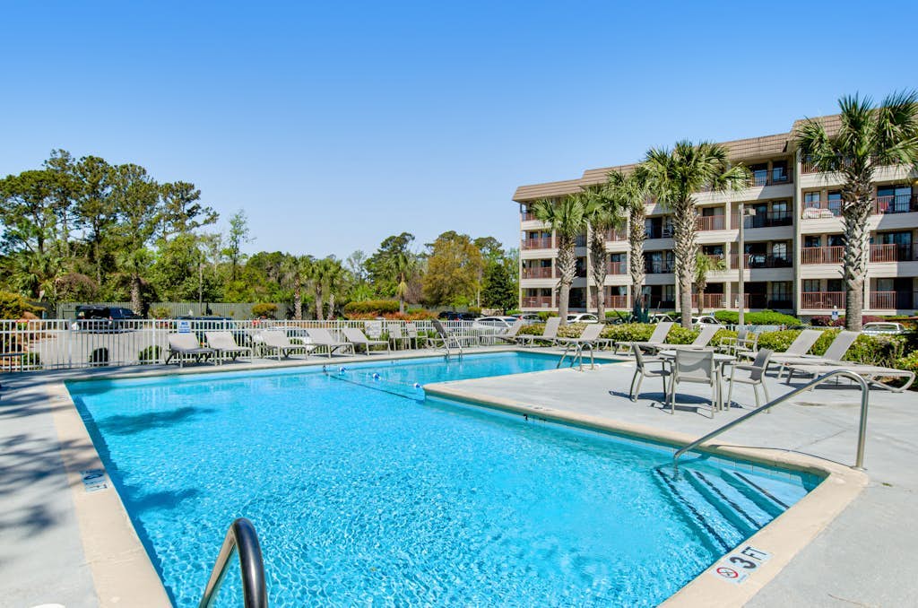 Water view retreat with balcony, beach gear, pools, tennis, hot tub, & gym