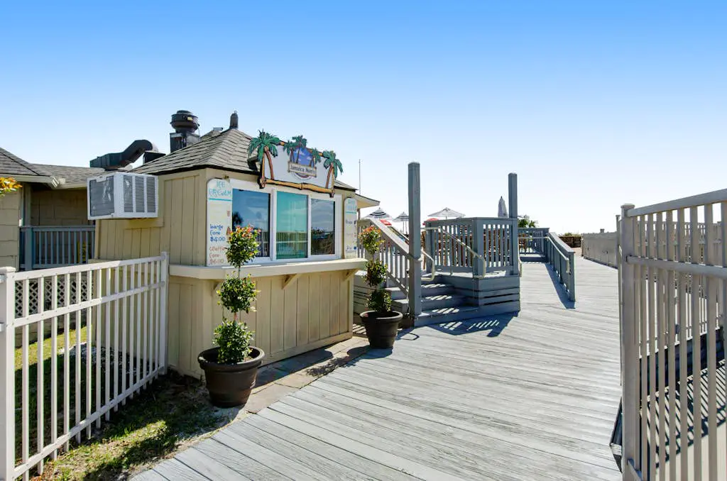 Water view retreat with balcony, beach gear, pools, tennis, hot tub, & gym