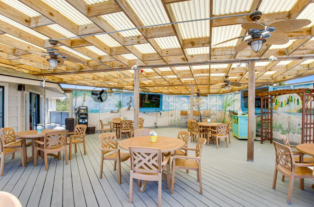 Water view retreat with balcony, beach gear, pools, tennis, hot tub, & gym
