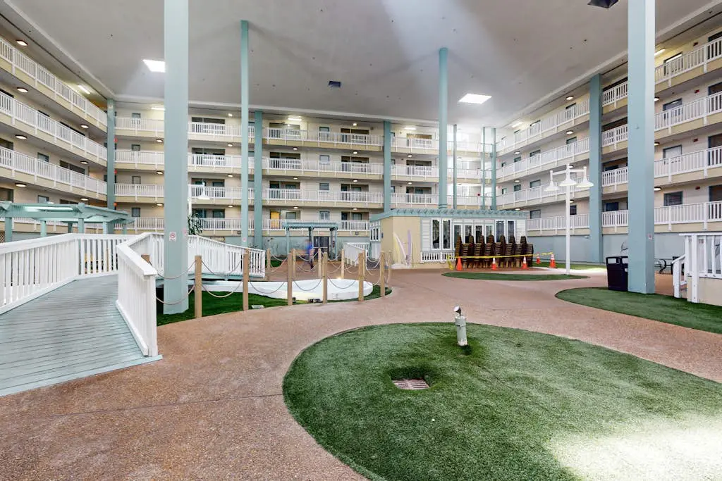 Updated coastal villa with pools, athletic courts, gym, smart TVs, AC, & W/D