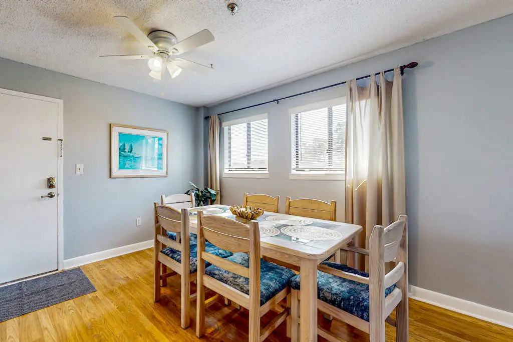 Updated coastal villa with pools, athletic courts, gym, smart TVs, AC, & W/D