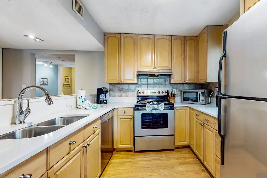 Updated coastal villa with pools, athletic courts, gym, smart TVs, AC, & W/D