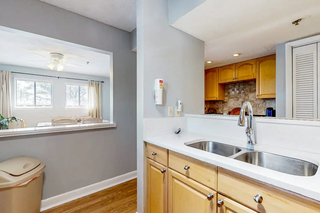 Updated coastal villa with pools, athletic courts, gym, smart TVs, AC, & W/D