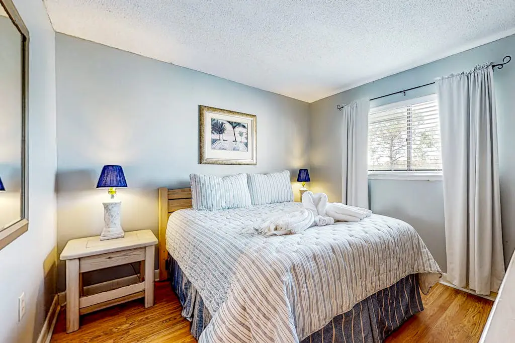 Updated coastal villa with pools, athletic courts, gym, smart TVs, AC, & W/D