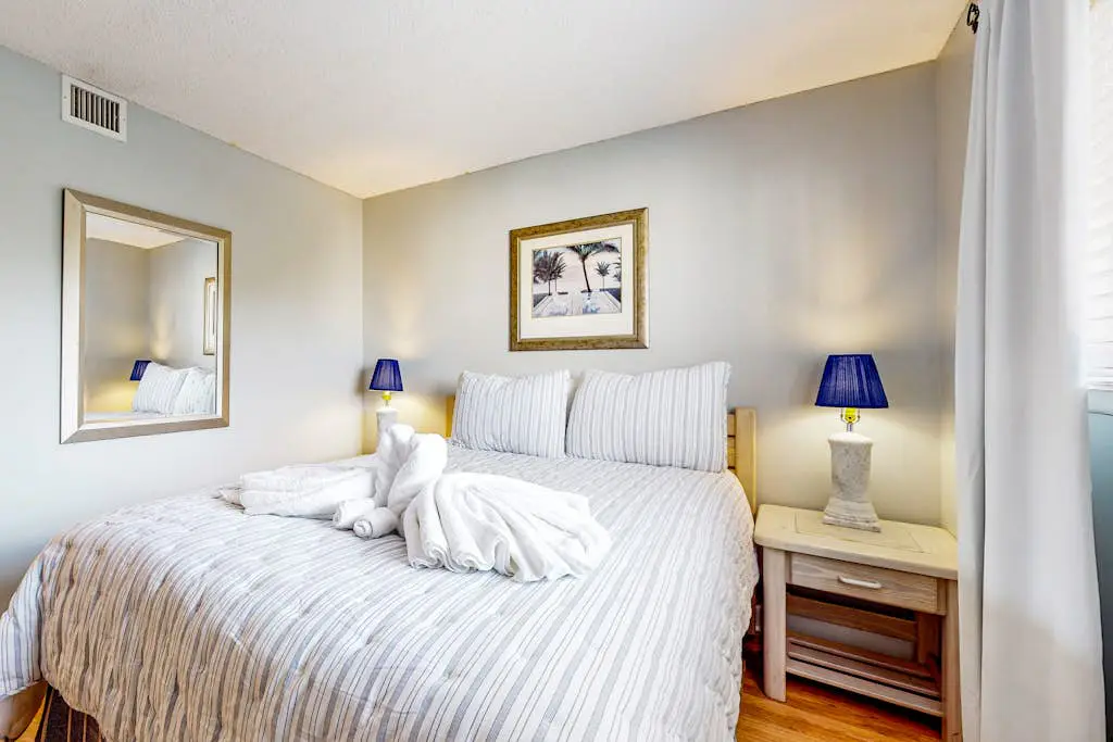 Updated coastal villa with pools, athletic courts, gym, smart TVs, AC, & W/D