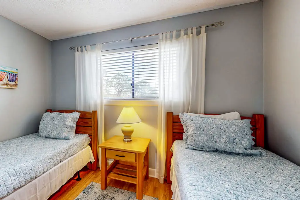 Updated coastal villa with pools, athletic courts, gym, smart TVs, AC, & W/D