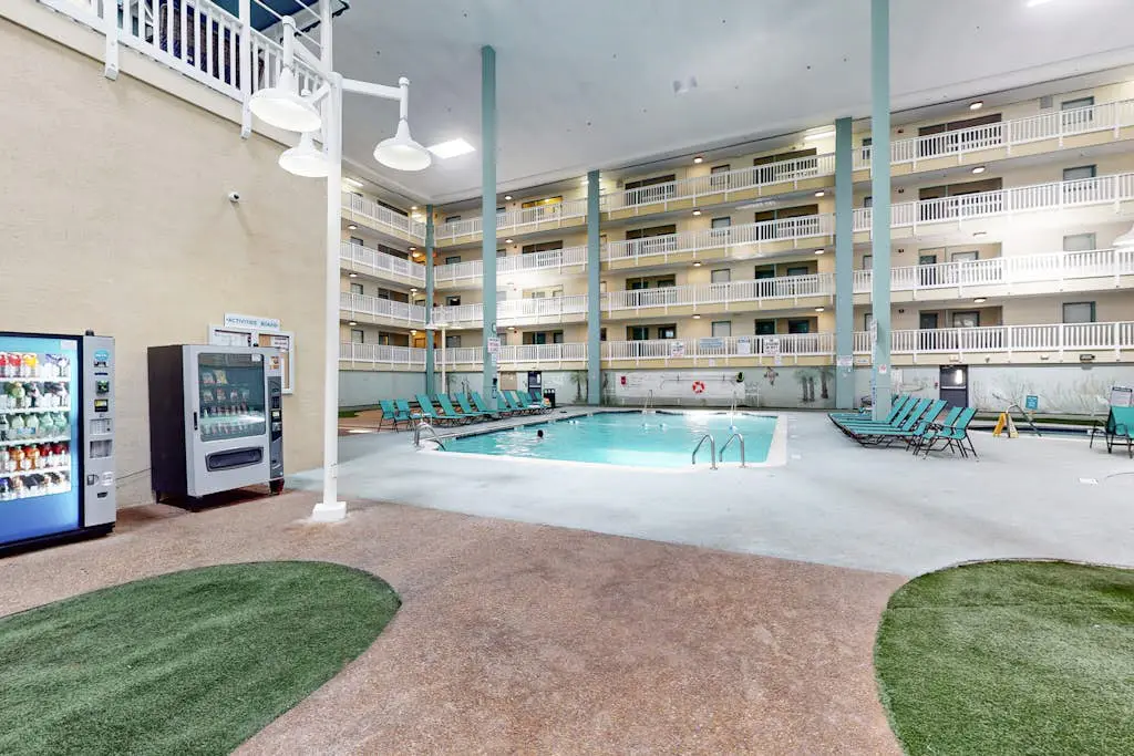 Updated coastal villa with pools, athletic courts, gym, smart TVs, AC, & W/D