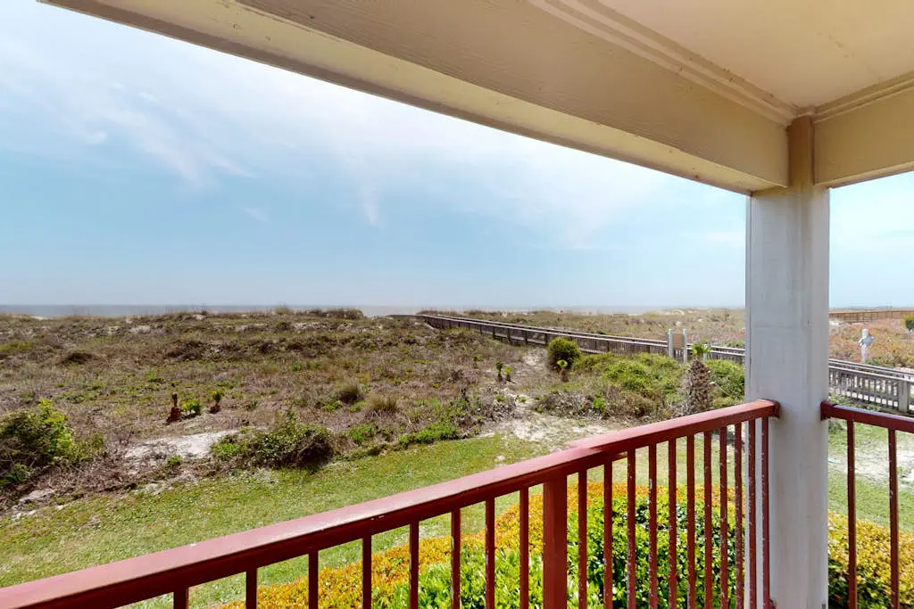 1st-floor condo near the beach with pool, tennis, balcony, gym, streaming, W/D