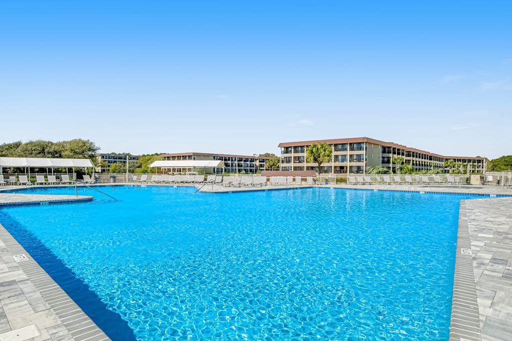 1st-floor condo near the beach with pool, tennis, balcony, gym, streaming, W/D
