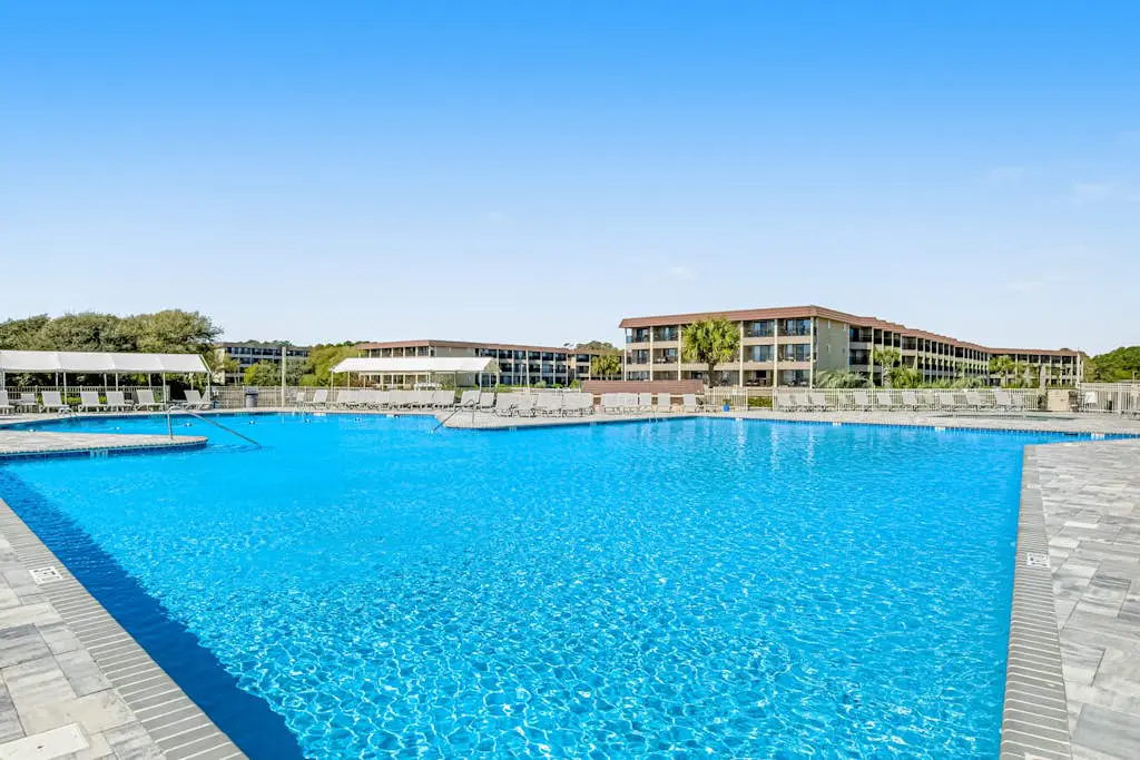 1st-floor condo near the beach with pool, tennis, balcony, gym, streaming, W/D