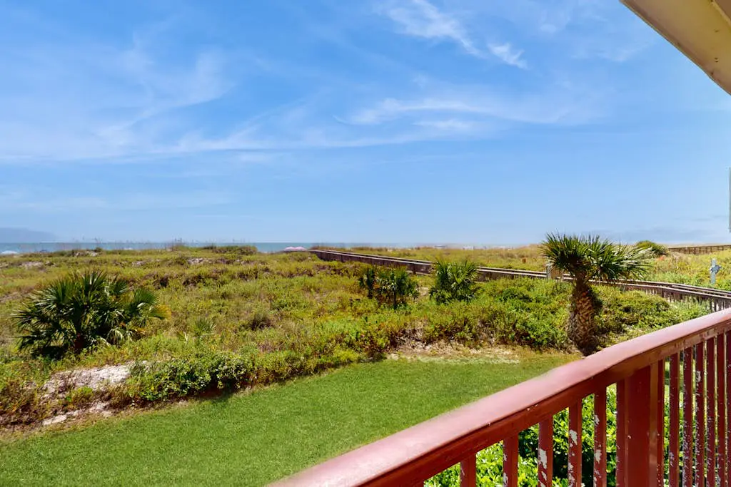 1st-floor condo near the beach with pool, tennis, balcony, gym, streaming, W/D