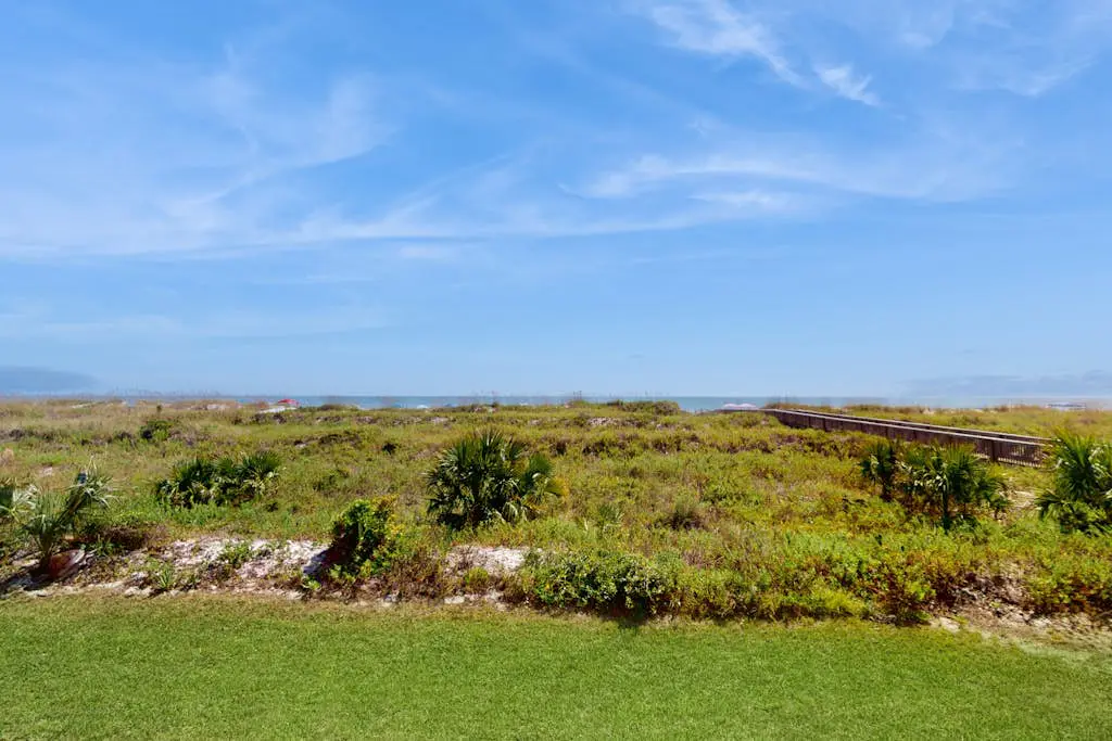 1st-floor condo near the beach with pool, tennis, balcony, gym, streaming, W/D