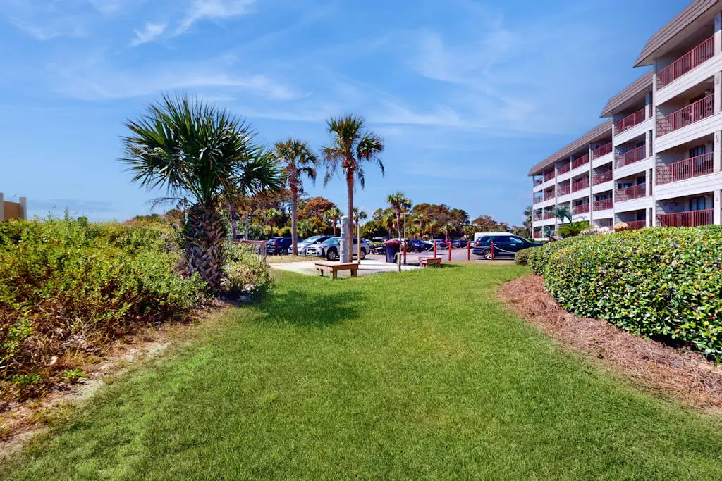 1st-floor condo near the beach with pool, tennis, balcony, gym, streaming, W/D