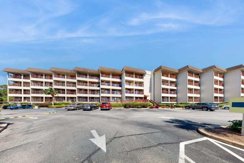 1st-floor condo near the beach with pool, tennis, balcony, gym, streaming, W/D