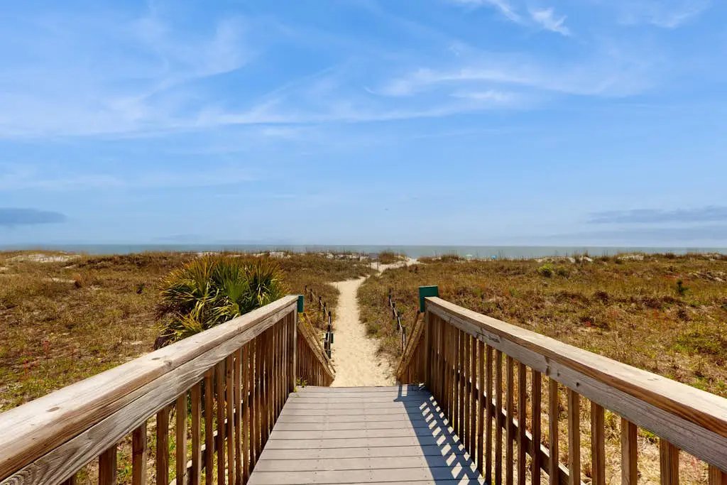 1st-floor condo near the beach with pool, tennis, balcony, gym, streaming, W/D