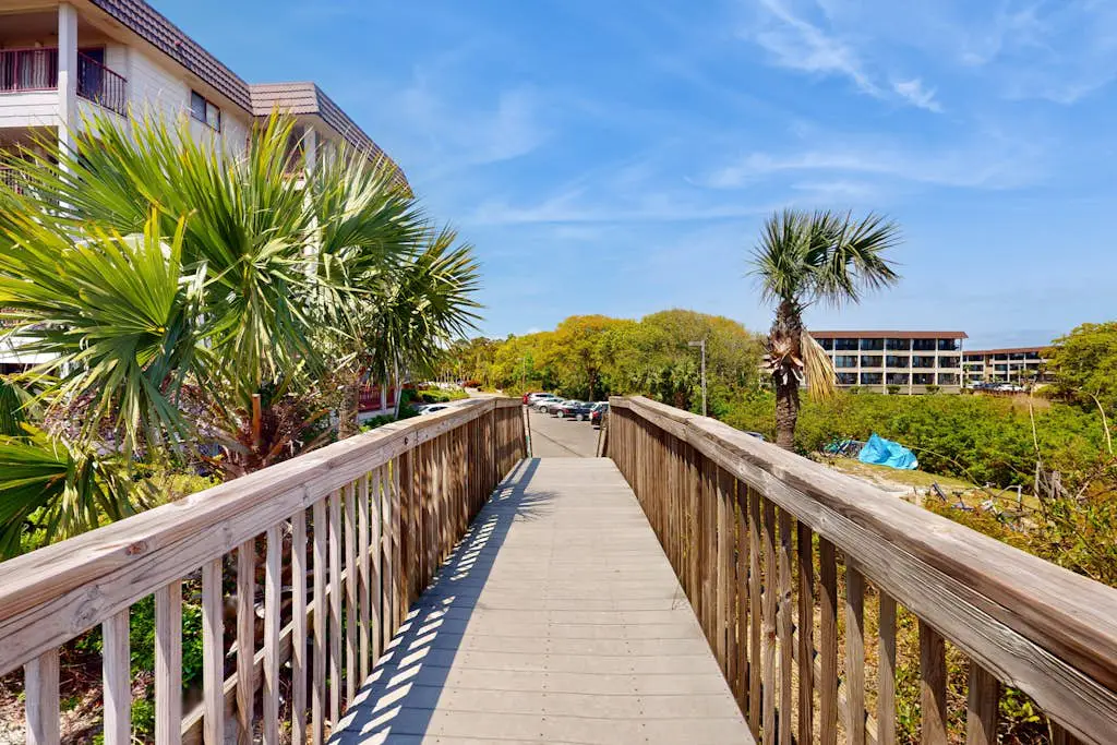 1st-floor condo near the beach with pool, tennis, balcony, gym, streaming, W/D