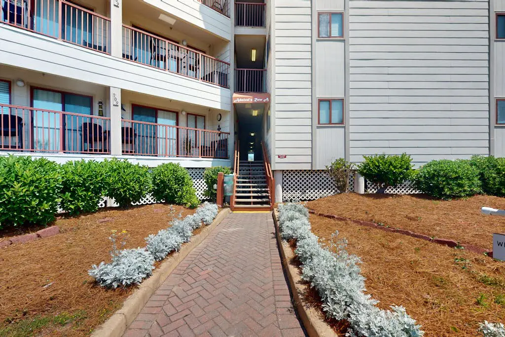 1st-floor condo near the beach with pool, tennis, balcony, gym, streaming, W/D