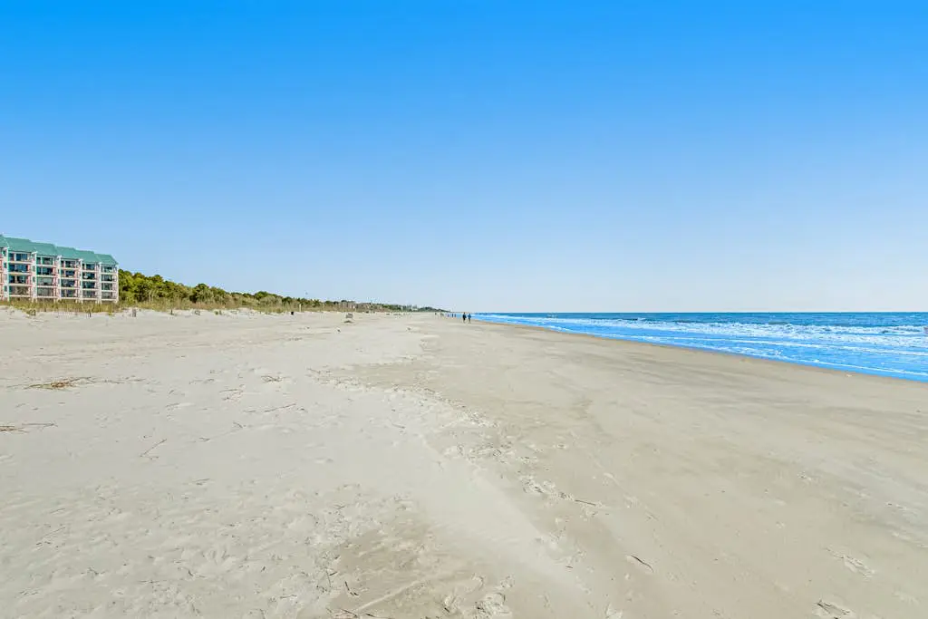 1st-floor condo near the beach with pool, tennis, balcony, gym, streaming, W/D