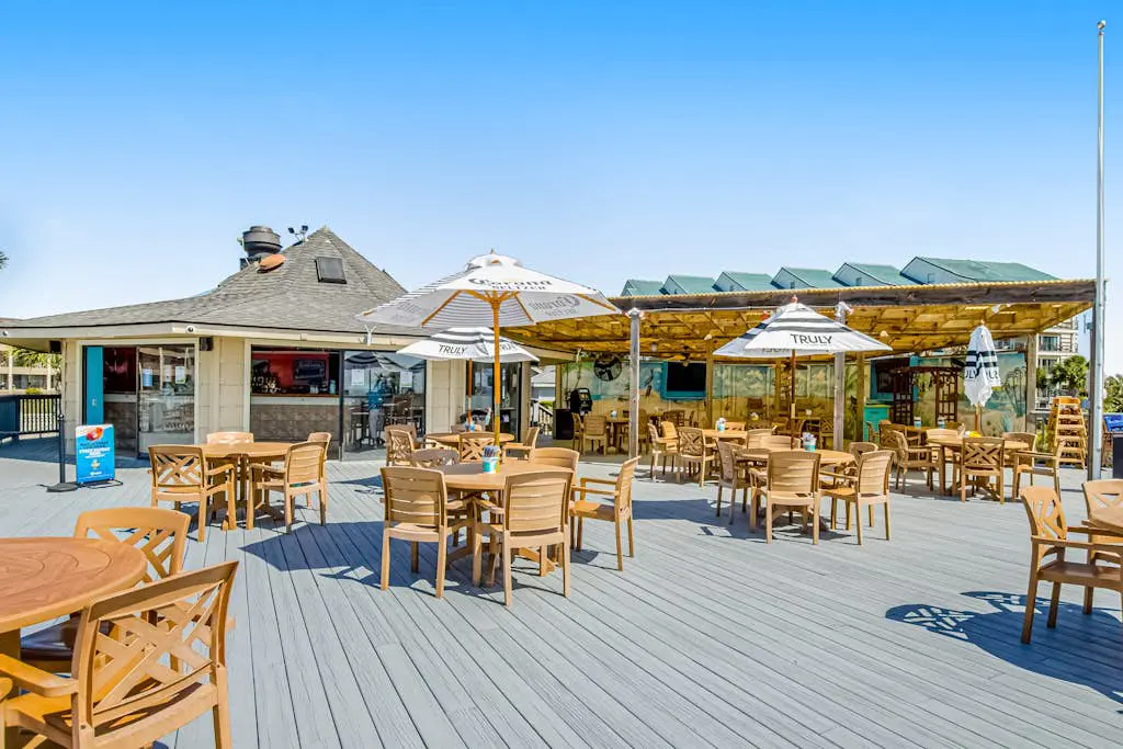 1st-floor condo near the beach with pool, tennis, balcony, gym, streaming, W/D