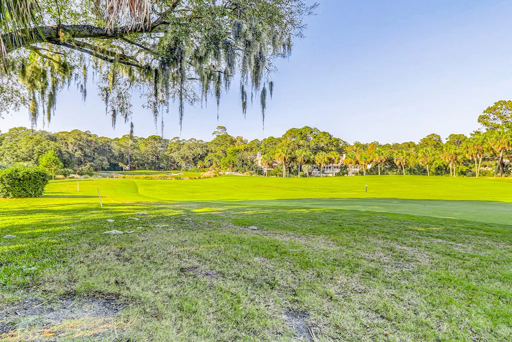 Snowbird-friendly golf getaway near the beach with pool, private deck, & W/D