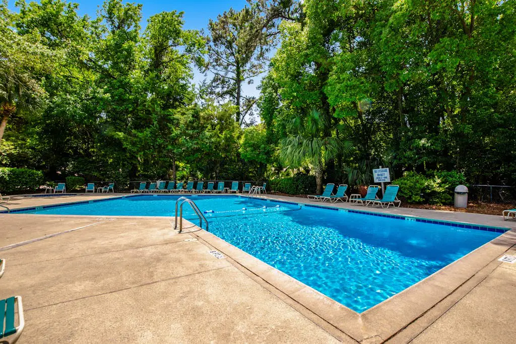 Coastal resort-style villa with pool, golf, & balcony - W/D, AC, & dog-friendly