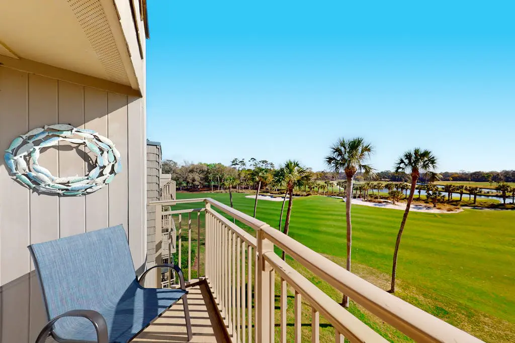 Coastal resort-style villa with pool, golf, & balcony - W/D, AC, & dog-friendly