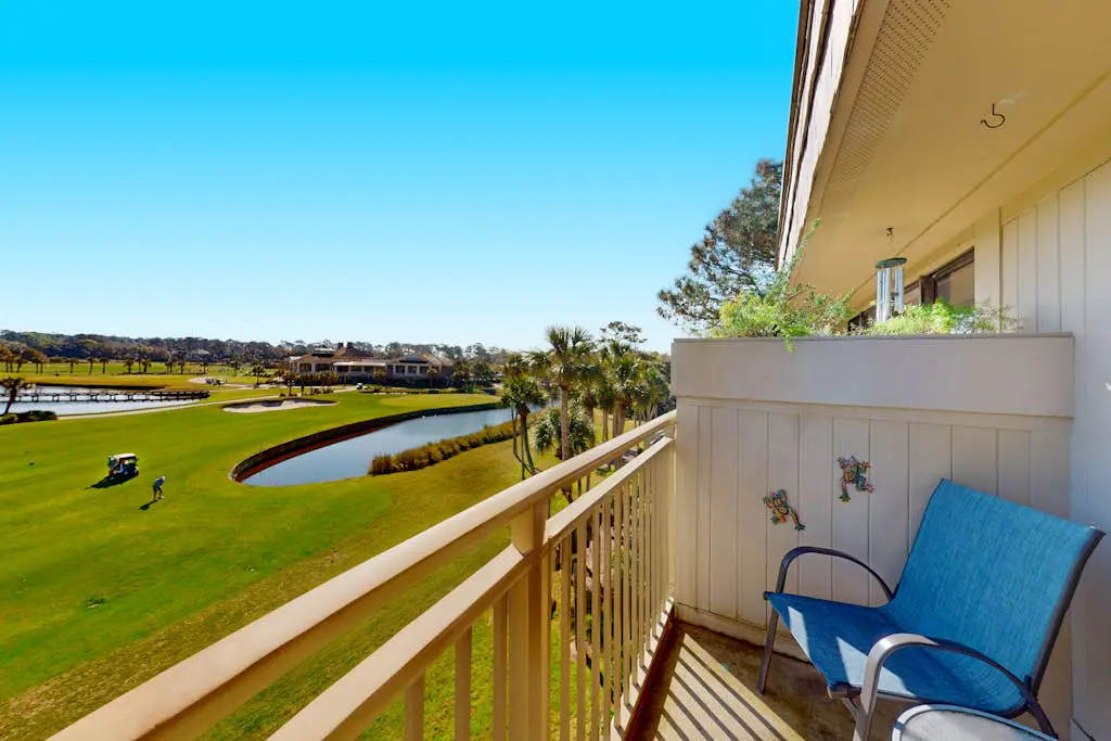 Coastal resort-style villa with pool, golf, & balcony - W/D, AC, & dog-friendly