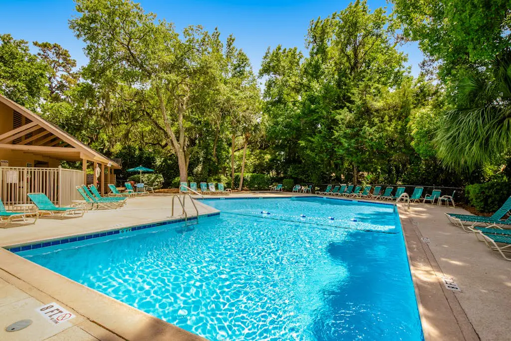 Coastal resort-style villa with pool, golf, & balcony - W/D, AC, & dog-friendly