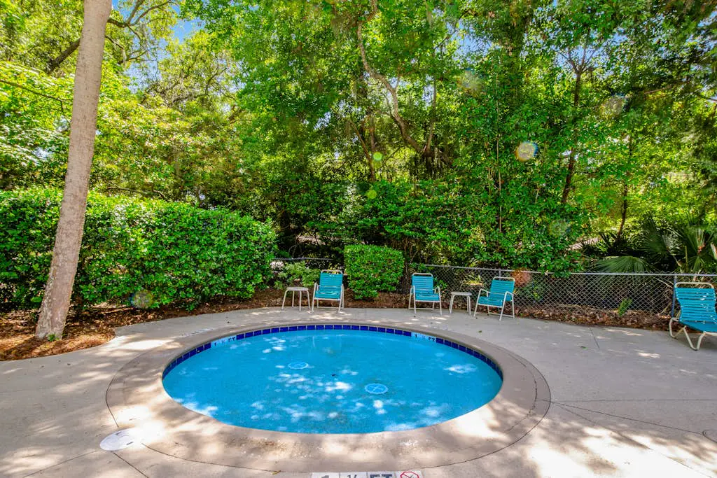 Coastal resort-style villa with pool, golf, & balcony - W/D, AC, & dog-friendly