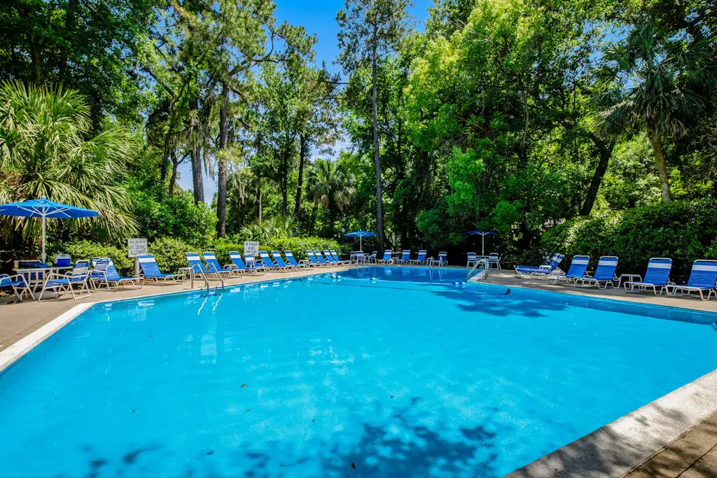 Coastal resort-style villa with pool, golf, & balcony - W/D, AC, & dog-friendly