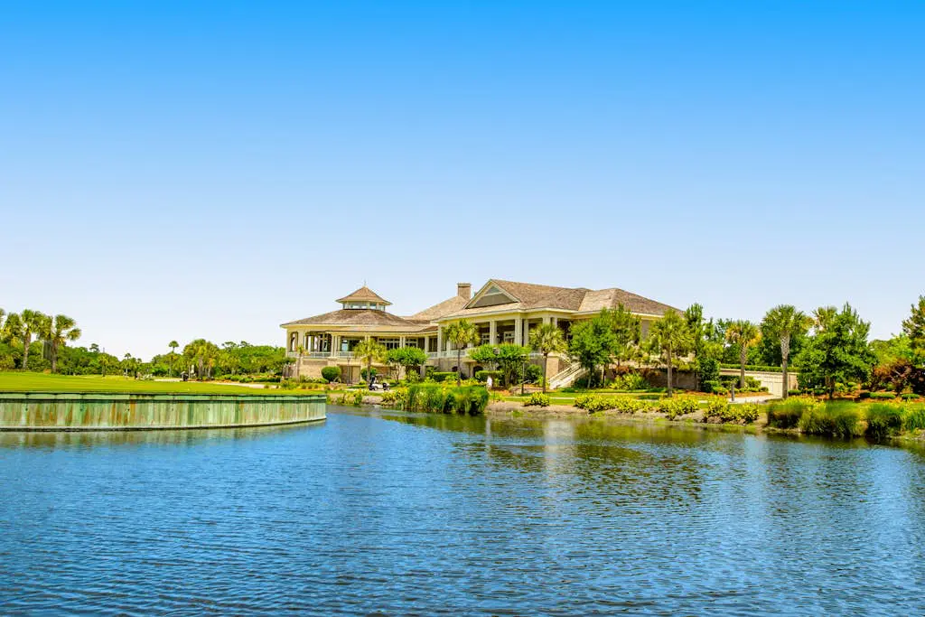 Coastal resort-style villa with pool, golf, & balcony - W/D, AC, & dog-friendly