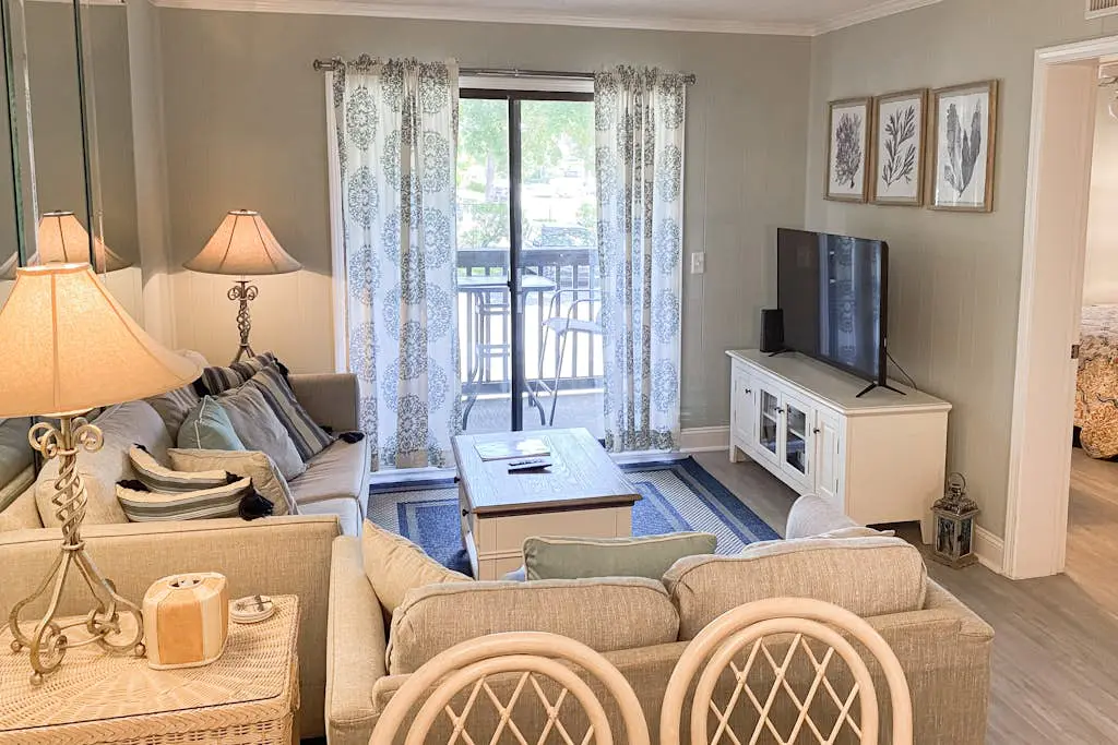 1st floor condo with  balcony, pools, tennis & close to beach