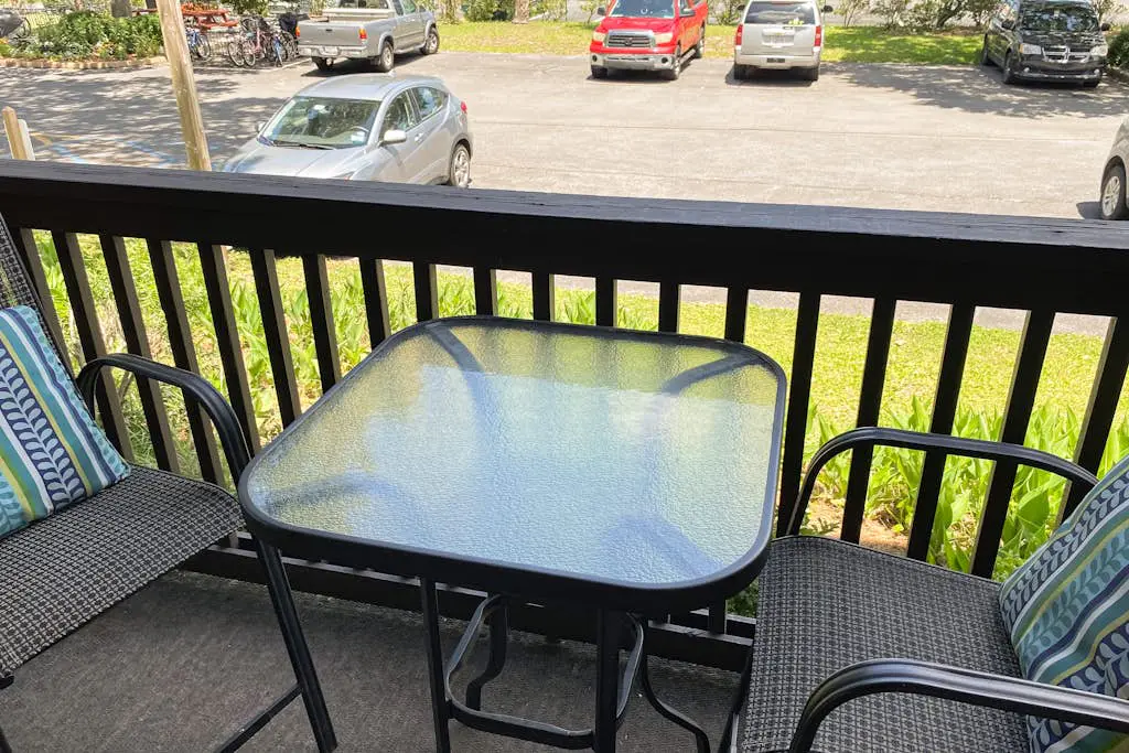 1st floor condo with  balcony, pools, tennis & close to beach