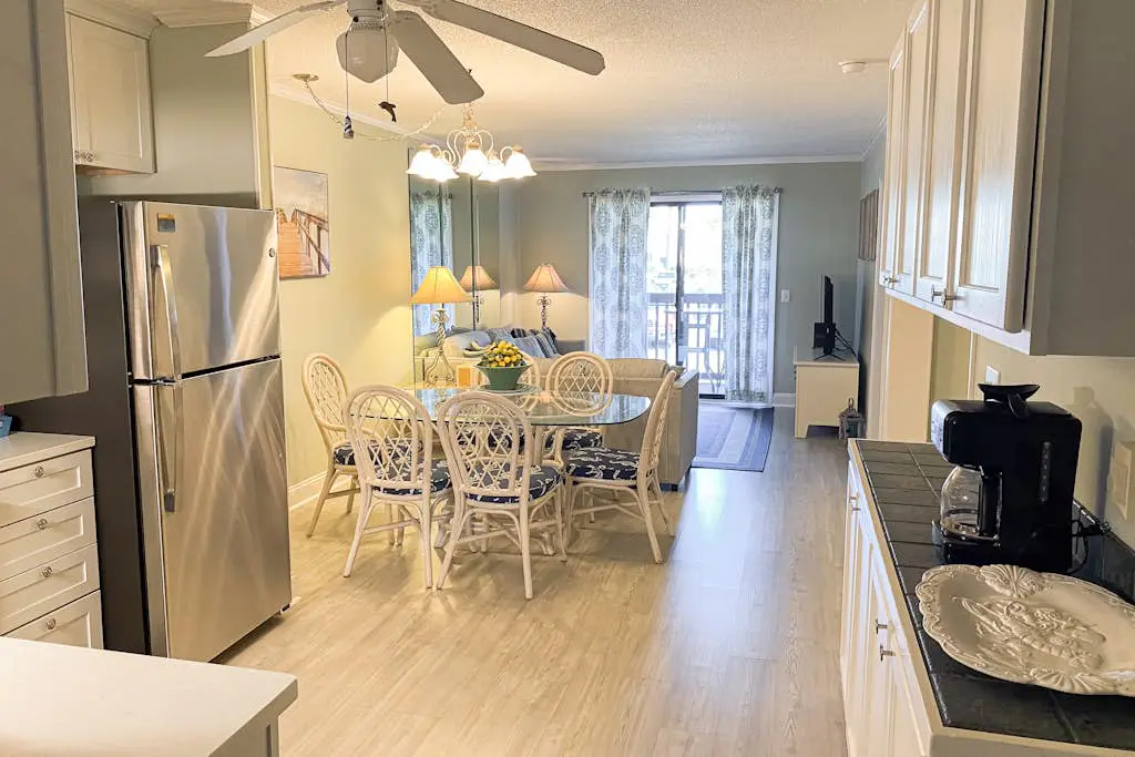1st floor condo with  balcony, pools, tennis & close to beach