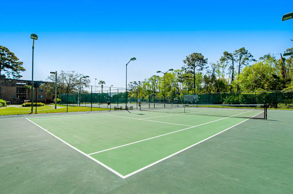 1st floor condo with  balcony, pools, tennis & close to beach