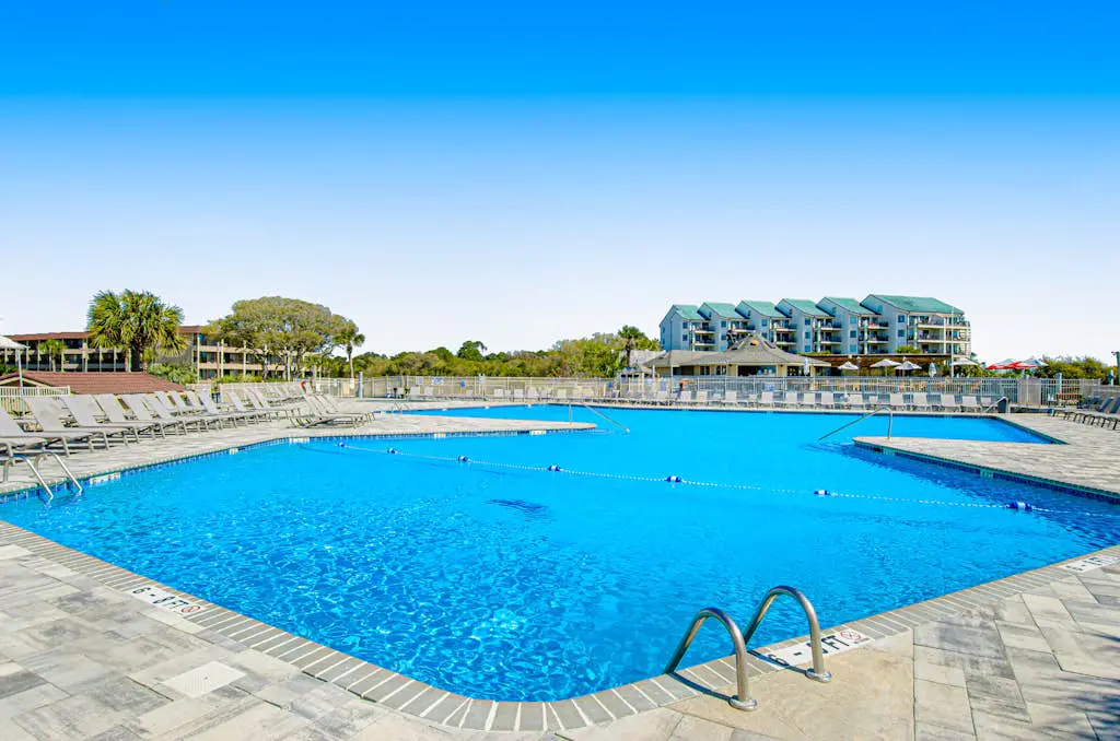 1st floor condo with  balcony, pools, tennis & close to beach